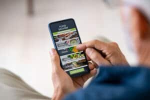 man using mobile app to order delivery food 2021 04 03 19 39 40 utc
